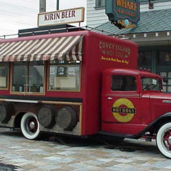 Beer and hot dog vending kiosk themed as old truck