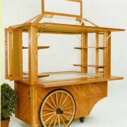 Wood retail merchandise pushcart features locking storage compartment