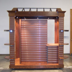 Retail merchandising mobile news stand kiosk with slat wall at airport